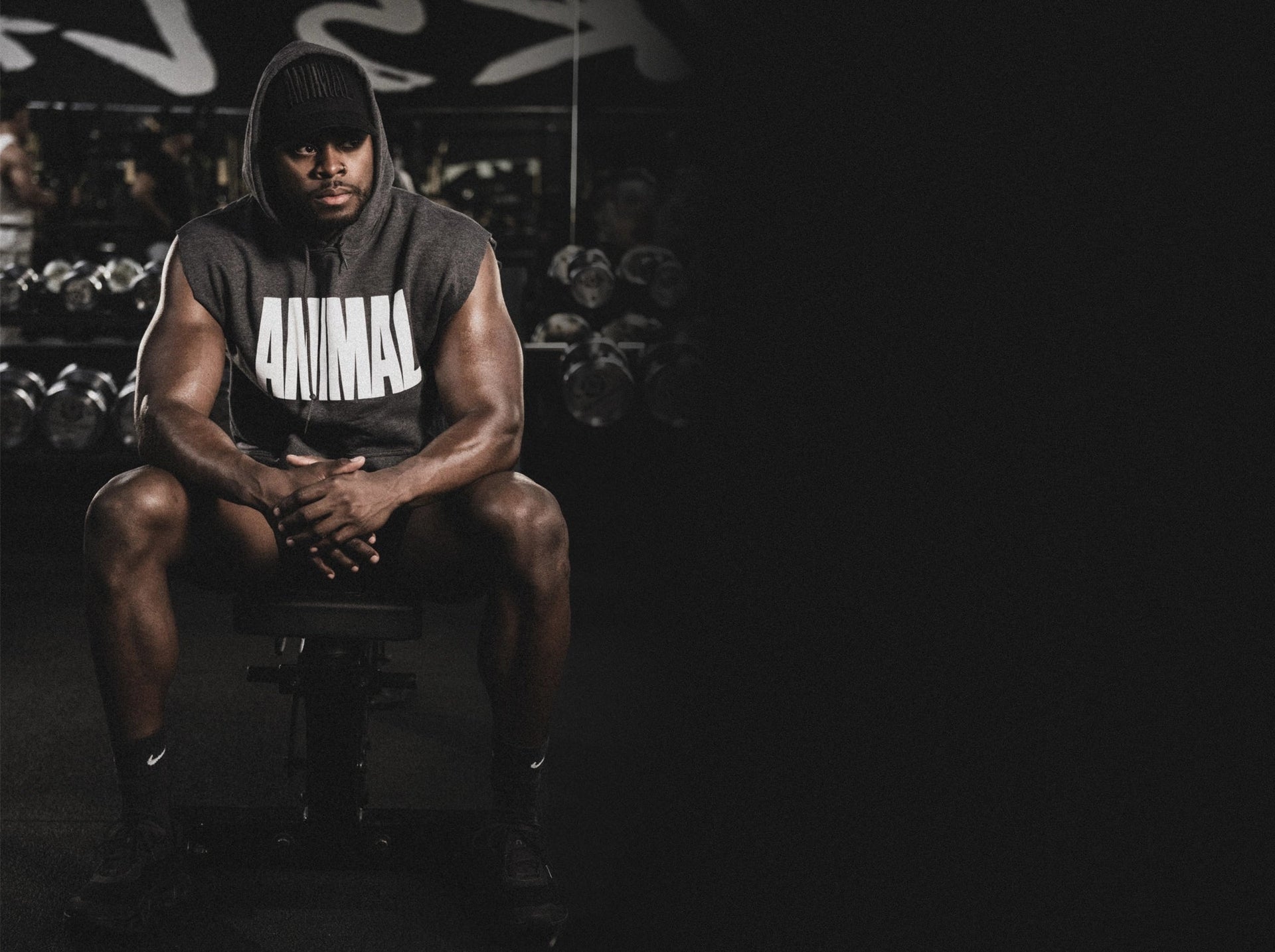 Athlete wearing an Animal shirt sitting in a gym